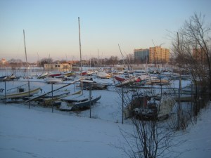 The Cooper Yacht Club, with the snow covered boats overlooking a snow covered frozen river.