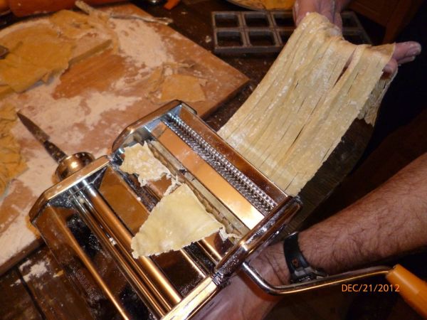 The pasta machine works very well. It can be used to roll the pasta progressively thinner and thinner, and then cut it for the style desired, in this case, fettuccine.